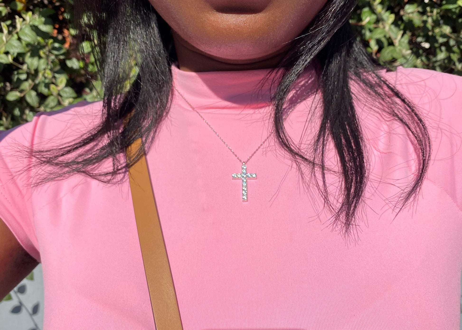 Classic Cross Pendant Necklace in rhodium-plated 925 sterling silver with cubic zirconia diamonds on model